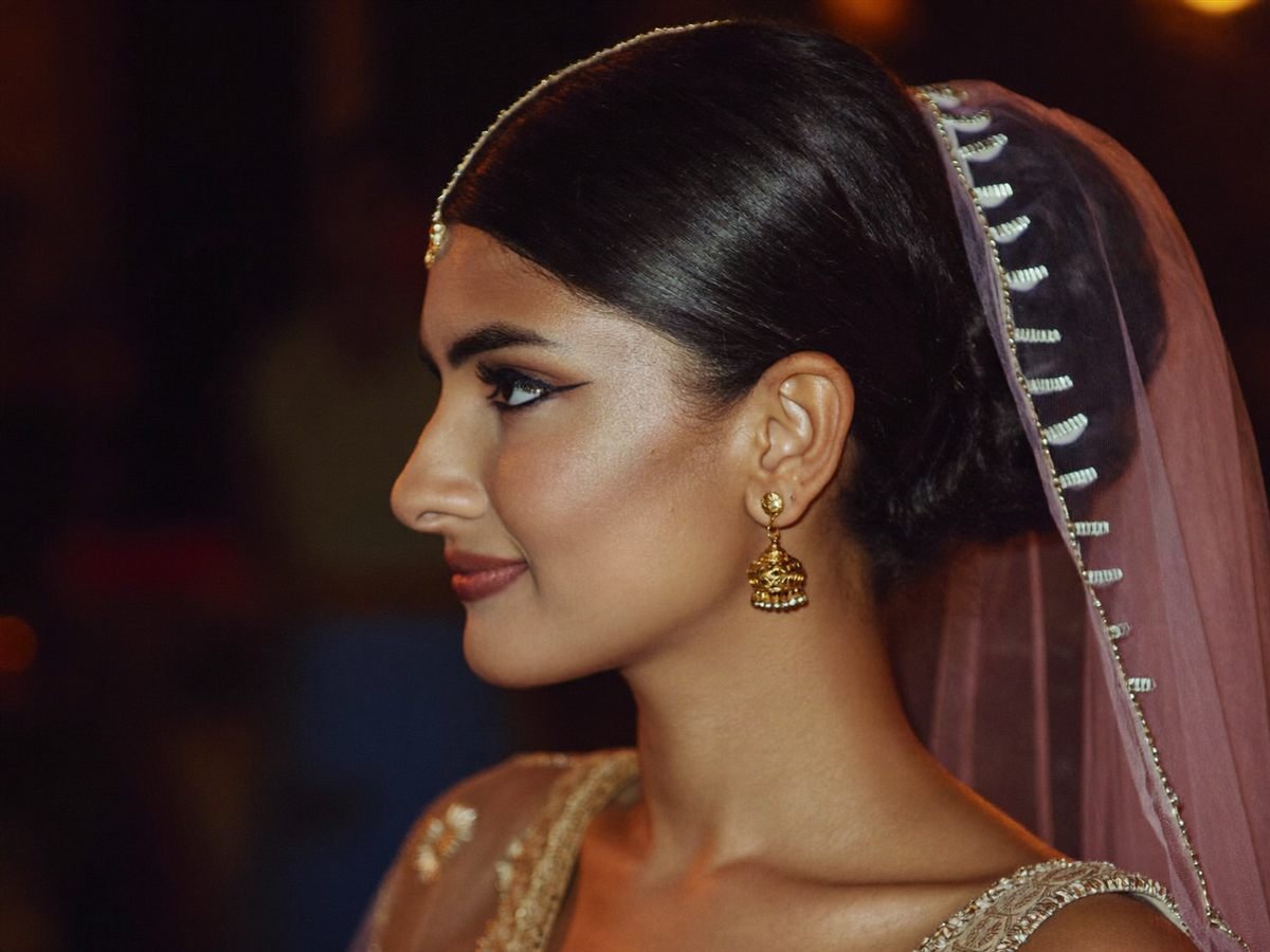 Bride with finished makeup, side profile, soft light